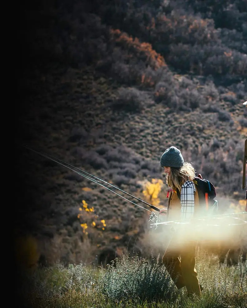 People walking with headlamps through smoky hills